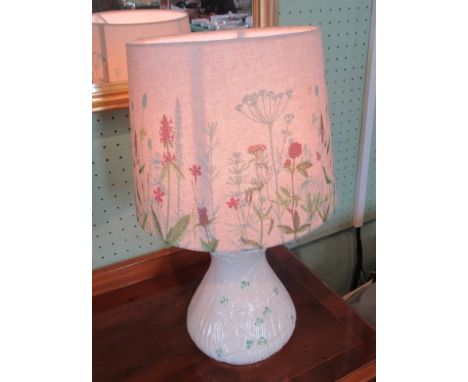 A 20th century Belleek porcelain table lamp with decorative shade.