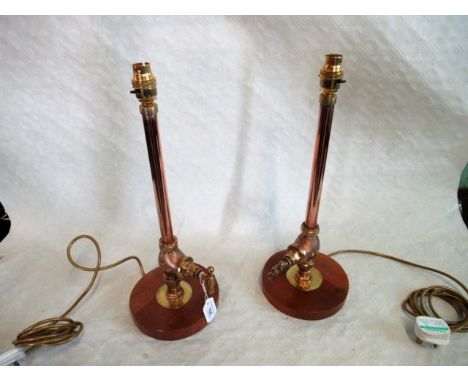 A pair of copper and brass plumbers pipe work novelty table lamps.