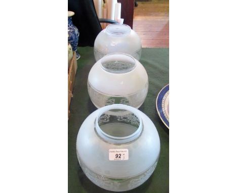 A set of three early 20th century acid frosted oil lamp diffusers.