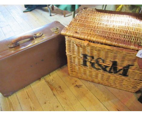 A large vintage Fortnum & Mason wicker hamper and a de mob-type fibre suitcase.