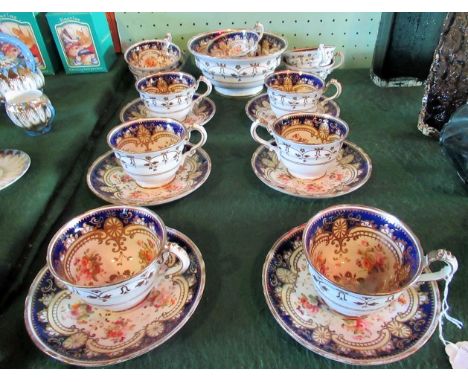 A Victorian English bone china part-tea service, decorated with blue borders and cut flowers. Condition Report:  Overall cond