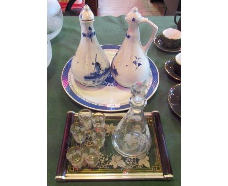 A pair of 20th century Delft gin ewers and stoppers, together with a 20th century Delftware charger and small etched glass li