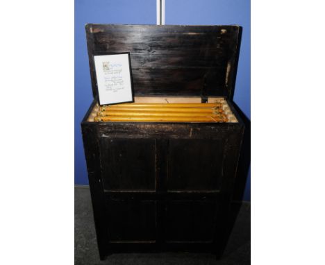 Stained pine alter frontal cabinet with panelled detail and hinged top  revealing five wall hangings, each mounted with appro
