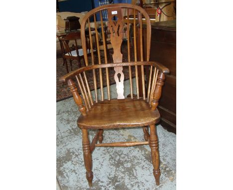 Elm stick back Windsor armchair wit h shaped understretcher and turned supports