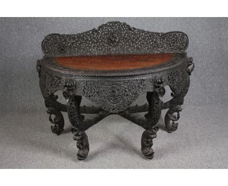 Console table, Burmese profusely carved hardwood. H.103 W.133 D.60cm. 