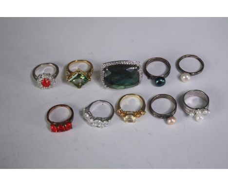 A collection of ten silver gem-set rings of various designs. Set with Labradorite, Fire opal, white topaz and pearl. Stamped 