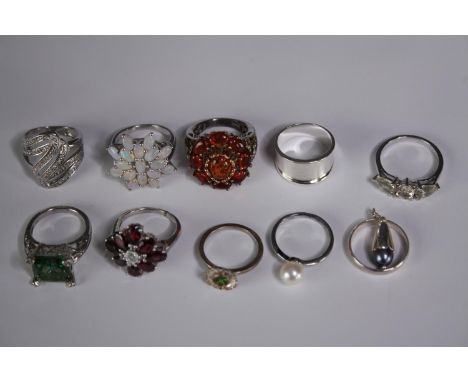 A collection of ten silver gem-set rings of various designs. Set with amber, opal, amethyst and garnet. Stamped 925. Various 