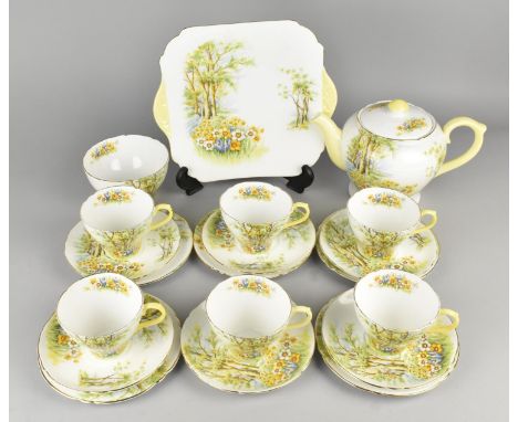 A Shelley Daffodil Time Tea Set to Comprise Six Cups, Six Saucers, Five Side Plates, Cake Plate, Teapot and a Sugar Bowl (Som