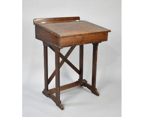 An Early 20th Century School Desk with hinged Sloping Lid to Galleried Back having Inset Grooves and Ceramic Inkwells, 56x47x