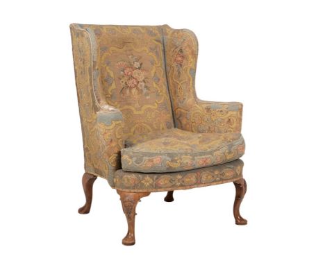 A walnut and tapestry upholstered wing armchair in George II style, early 20th century, 104cm highCondition Report: Marks, kn