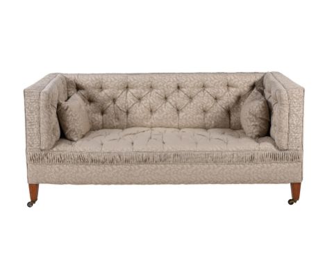 A Victorian walnut and upholstered sofa, late 19th century, in the manner of Howard & Sons, 82cm high, 183cm wide, 81cm deep 