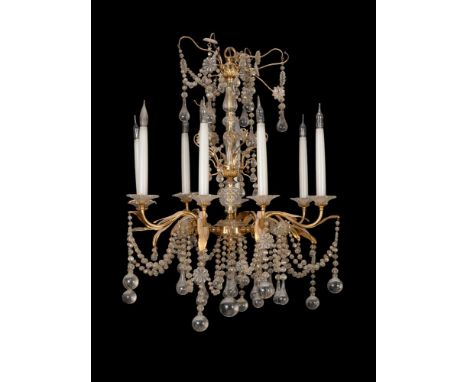 An ormolu and glass eight light chandelier, 20th century, with glass bead swags, pear and spherical glass pendants, 77cm high
