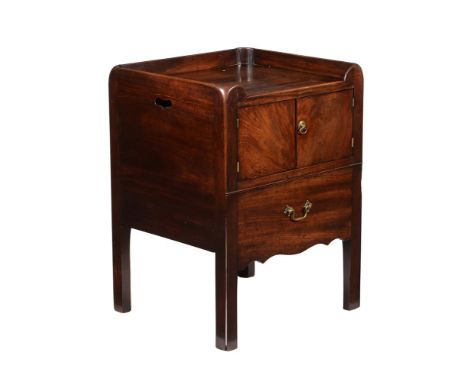 A George III mahogany commode, circa 1790, with pair of cupboard doors above a slide, 75.5cm high, 56cm wide, 51cm deep 