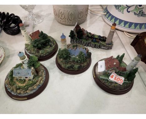 Set of four Thomas Kinkade, light up lighthouses with a lighthouse business card holder. Not available for in-house P&amp;P 