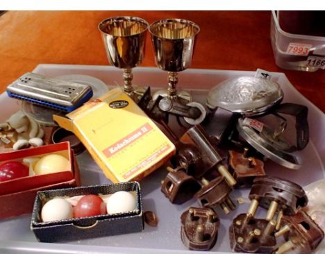 Tray of mixed collectables to include billiard balls, cine film, harmonica, bakolite plug tops etc. Not available for in-hous