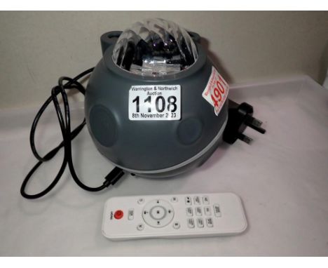 Bluetooth speaker which projects images of stars and planets on walls, with remote control working at lotting. Not available 