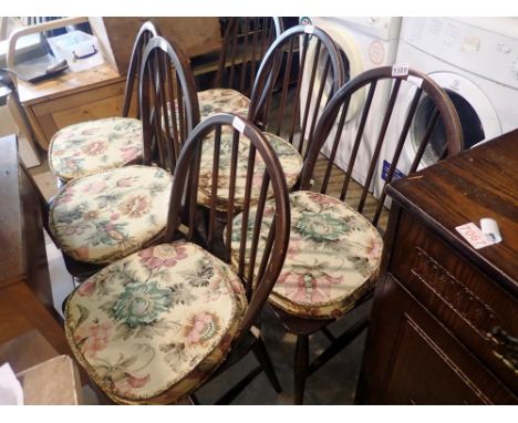 Set of six Ercol oak stick back chairs. Not available for in-house P&amp;P 