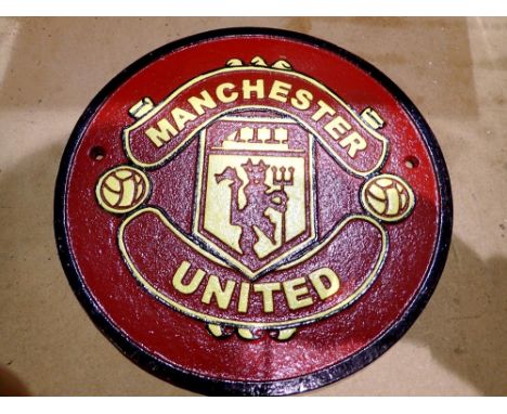 Cast iron Manchester United plaque. D: 25cm. UK P&amp;P Group 2 (£20+VAT for the first lot and £4+VAT for subsequent lots) 
