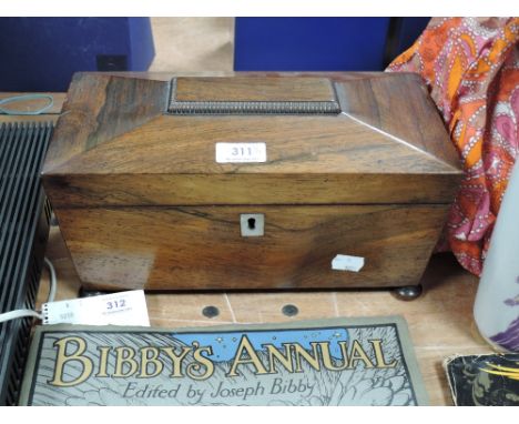 A Victorian rosewood casket form tea caddy on bun feet
