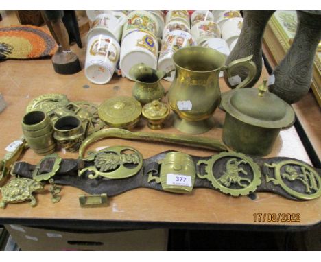 A selection of brass wares including Indian chase work vase, horse brasses and shoe horn
