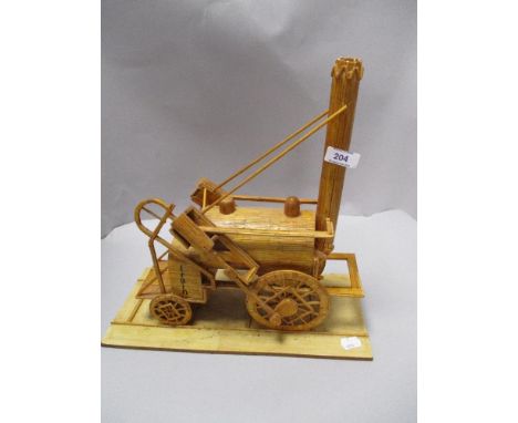 A 20th century Folk Art match stick model of the Stephenson Rocket steam locomotive