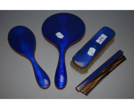 An Art Deco era dressing table brush and mirror set with blue guilloche enamel backs