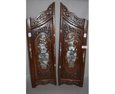 A pair of Chinese mirrored wooden panels inlaid with mother of pearl vase design