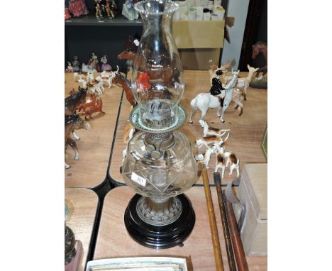 A Victorian oil lamp having cut glass resevoir with brass and ceramic base
Base approx 20cm diameter, hieght 53cm