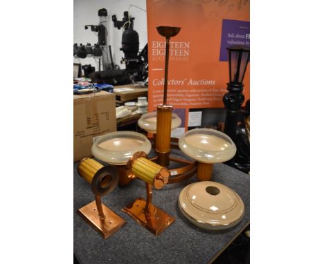 An Art Deco ceiling drop light fixture with two wall lights having copper and bakelite design