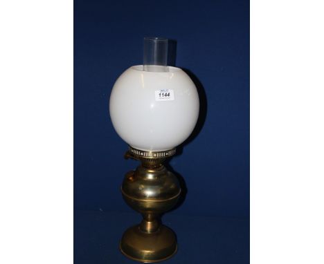 A Brass Oil Lamp with chimney and shade