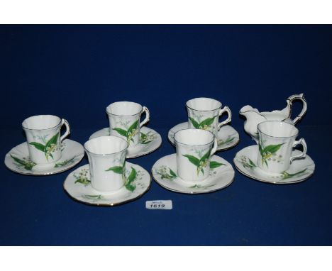 A Royal Worcester 'Hammersley' lily of the valley decorated part Coffee Set comprising six Cups (one with hairline crack) and