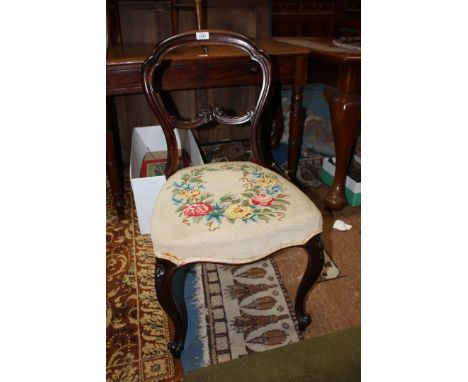 A Victorian Mahogany Dining Chair, single carved bar back in a shaped hoop frame, tapestry seat, standing on scroll end cabri