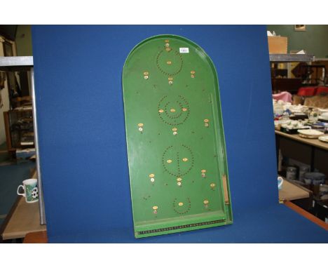 A Wooden Bagatelle board with original balls.