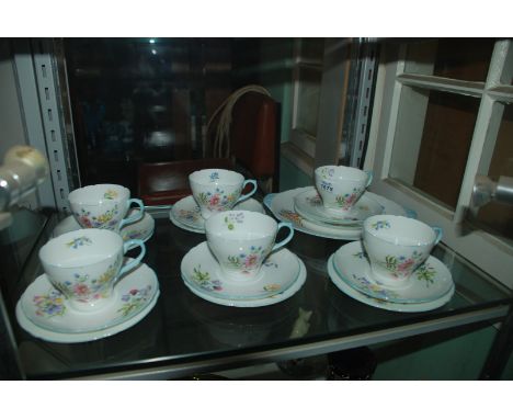 A Shelley part Teaset in ''Wild Flower'' design, comprising six Cups and saucers, six Tea Plates and a Cake Plate