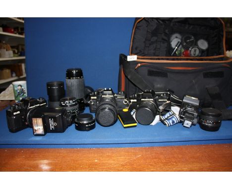 An extensive 35mm SLR Camera Outfit comprising of Three Praktica BMS Camera Bodies, A Carl Zeiss 28mm f/2.8 wide angle Lens, 