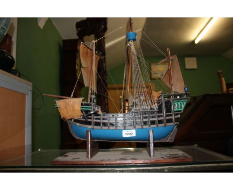 A model of a Galleon with masts and sails raised, 16 1/2" tall overall