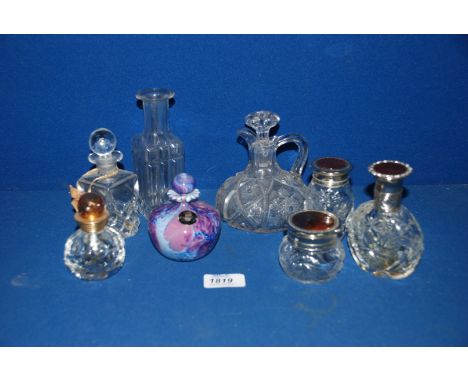 A purple Guernsey Island studio glass Perfume Bottle, a Christian Dior perfume bottle, a clear glass jug plus other bottles a