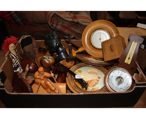 A quantity of Treen including two barometers, plaques, African carved ornaments, nutcracker, paper knives, etc.