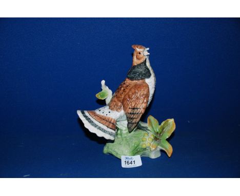 A pottery model of a Ruffed Grouse