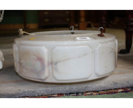 A 1960's style glass ceiling light shade with marble effect design