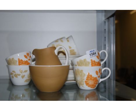A Wedgwood 'Lynton' pattern Teaset, white ground with orange and ochre Anemone design, comprising six each cups, saucers and 