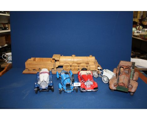 Three Burago model cars, a tin truck and bike, plus a Matchstick model of a train