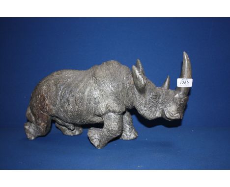 A carved hardstone model of a Rhinoceros.  18'' from nose to tail.  9'' high