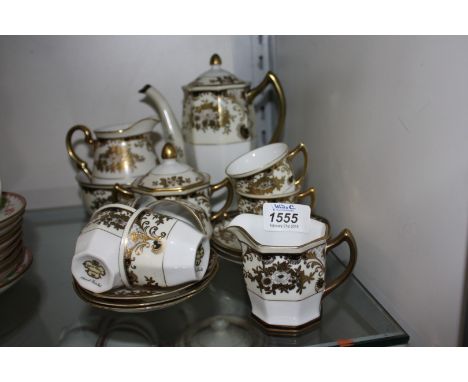 A ''Meito'' Coffee set, white ground with black and gilt design, comprising six Cups and saucers, Coffee Pot, cream Jug and s