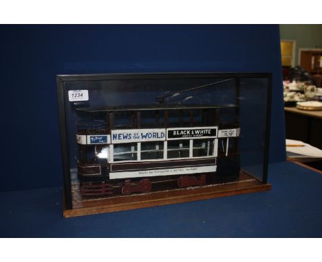 A model of a Tram in a glass display case, 20'' overall length