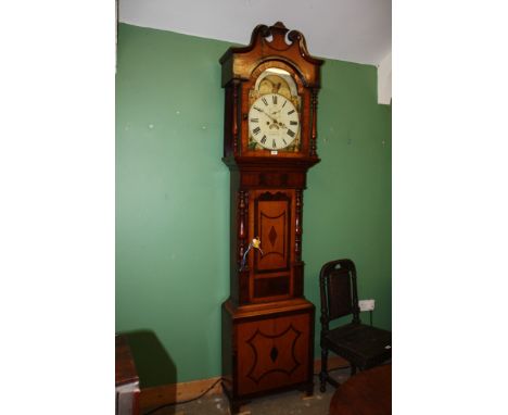 An elegant Oak and Mahogany 19th c. Longcase Clock having swan pediment with raised central moulding, the hood having arch to