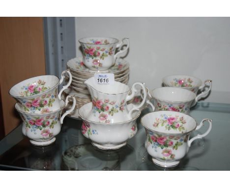 A Royal Albert ''Moss Rose'' Teaset comprising six cups and saucers, six tea Plates, Milk Jug, Sugar Bowl and Cake Pate.