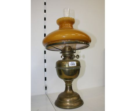 A 1960's Oil Lamp with orange glass shade, brass base and chimney