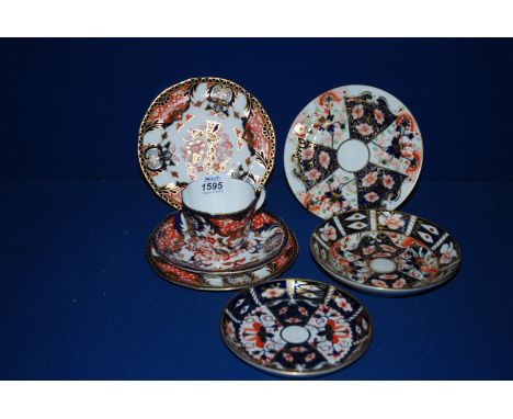 A Royal Crown Derby trio in pattern no. 383 plus three other Royal Crown Derby saucers and plates, all in imari colours