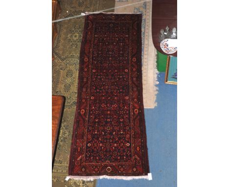 An attractive and good Malayer Runner from North West Persia, the indigo field with allover design of leafy vines and flower 
